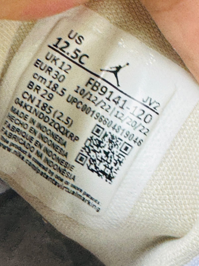 Air Jordan 1 Mid kids sneaker size label showing 30 FR
