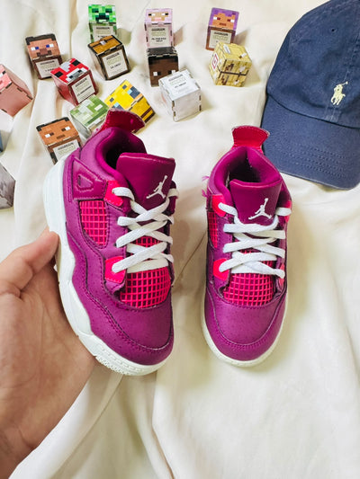 Air Jordan 4 kids sneakers magenta pink pair
