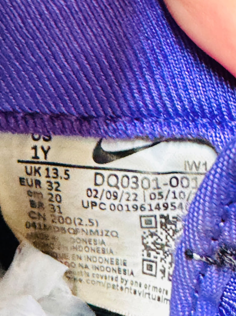 Nike kids sneaker size label showing 32 FR